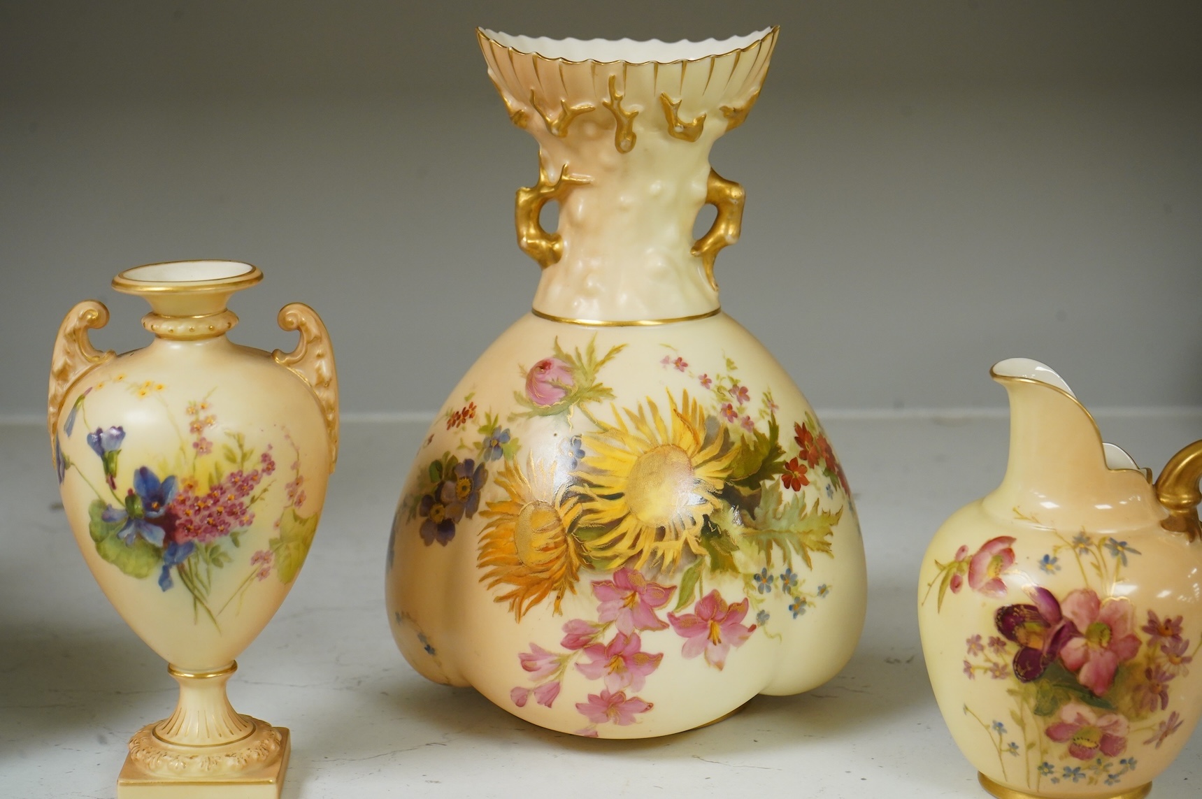 Three pieces of Royal Worcester blush ivory porcelain vessels, tallest 20cm